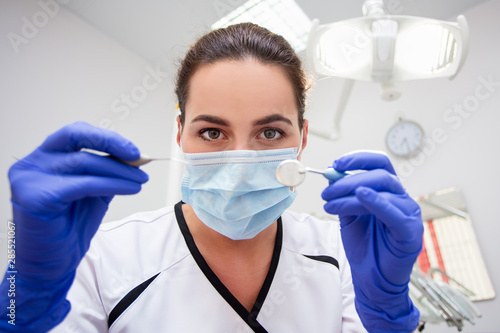 close up portrait of dentist working in modern clinic