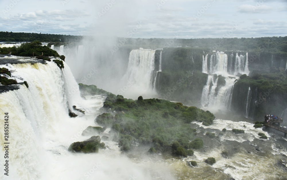 Iguazu Falls or Iguaçu Falls are waterfalls of the Iguazu River on the border of the Argentine and Brazil. Together, they make up the largest waterfall system in the world.