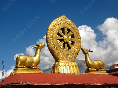 Jokhang temple roof detail of golden dharma wheel and animals, Llasa, Tibet, China, Asia