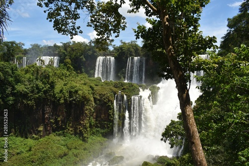 Iguazu Falls or Igua  u Falls are waterfalls of the Iguazu River on the border of the Argentine and Brazil. Together  they make up the largest waterfall system in the world.