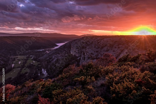 sunset in the mountains abovr csnyon of Krka river