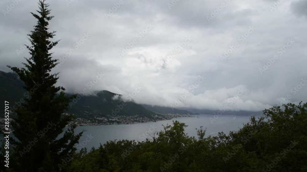 Before the storm - White clouds covered the mountains and the Bay of Kotor, Montenegro. Before the storm - White clouds covered the mountains and the Bay of Kotor, Montenegro.