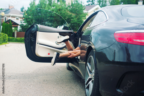 Fototapeta A strange dangerous man in car try to kidnap toddler lonely scared girl