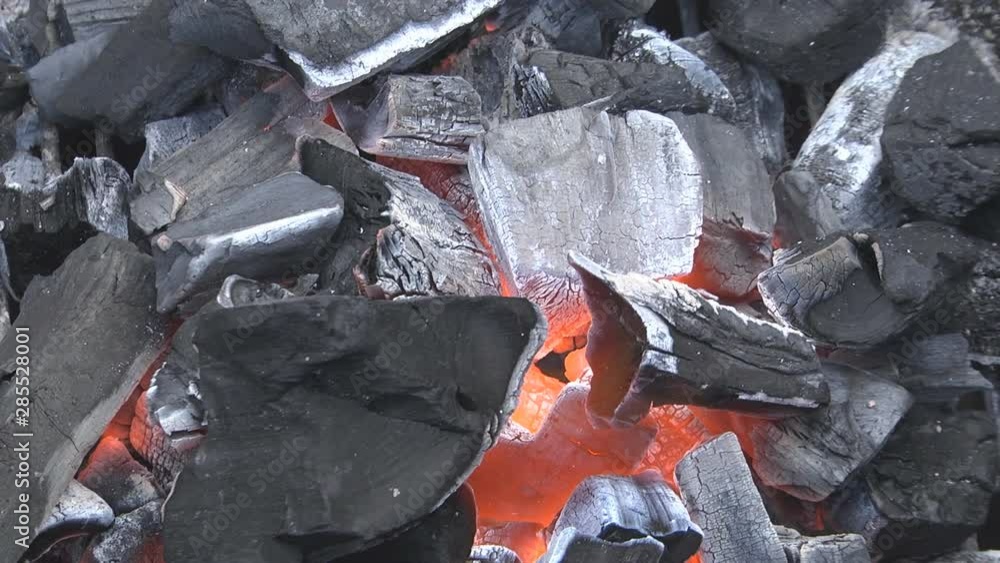 kindling of charcoal in the barbecue with an electric heat gun of high temperature, a stream of hot air kindling of charcoal in the barbecue with an electric heat gun of high temperature, a stream of hot air