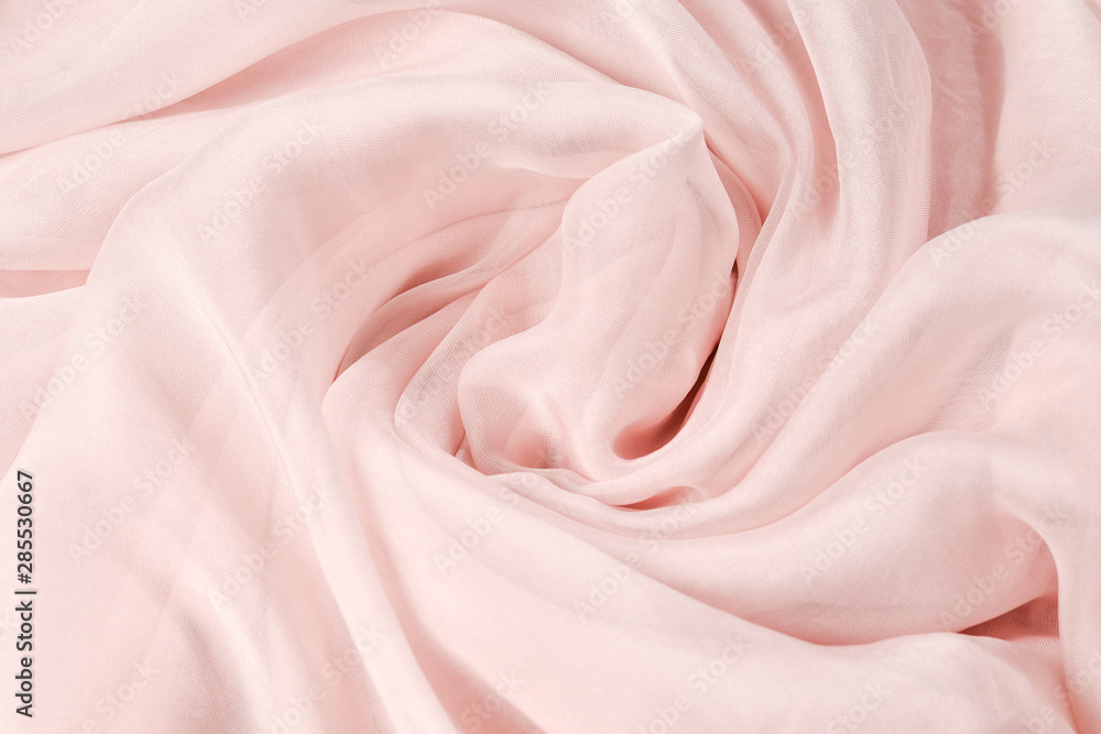 Soft smooth pink silk fabric background. Fabric texture. Soft smooth pink silk fabric background. Fabric texture.