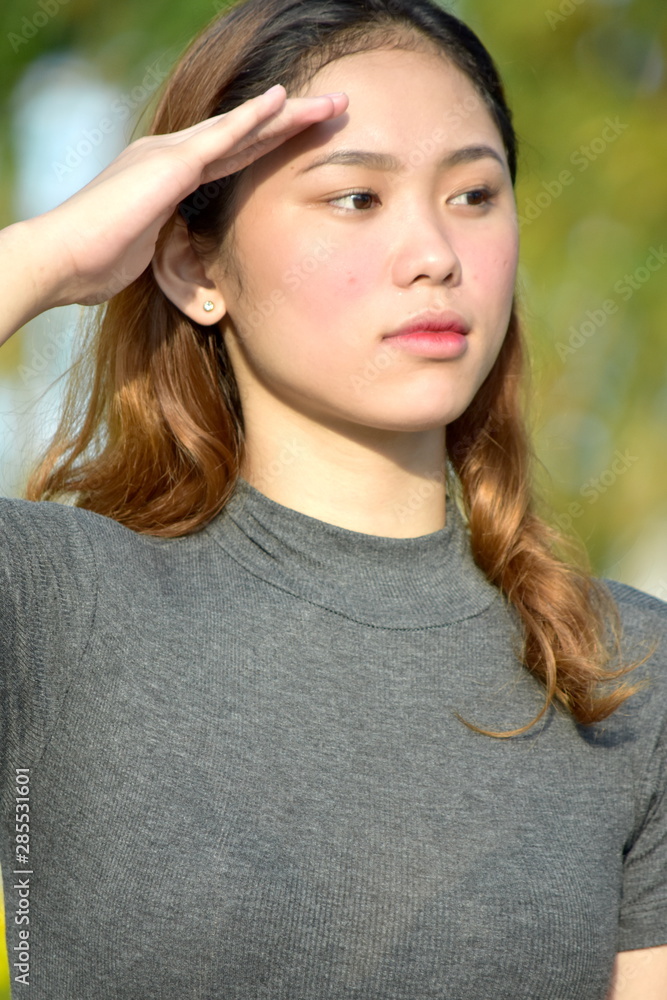Youthful Diverse Adult Female Saluting