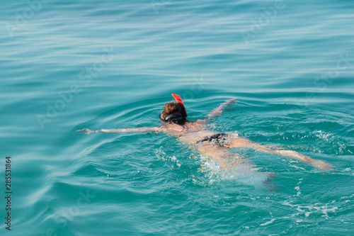 Woman snorkeling in the turquoise red sea