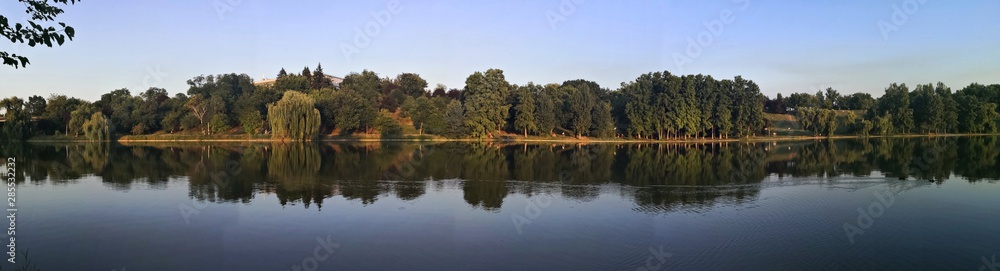 Fototapeta premium Reflection of trees in lake