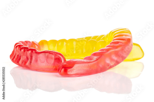 Group of two whole bright colourful jelly worm candy isolated on white background