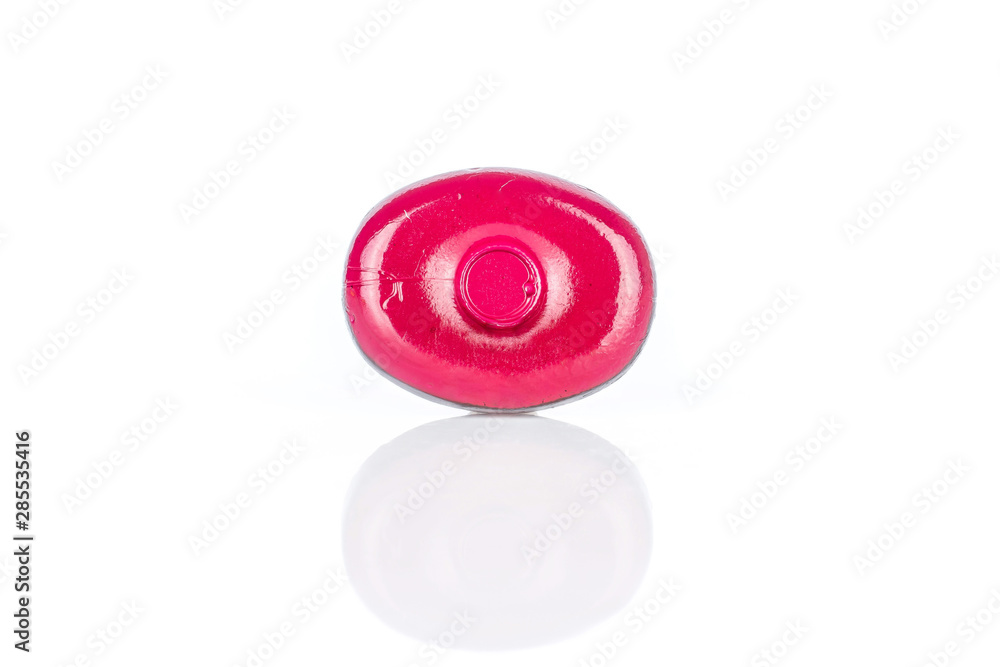 One whole dark red colourful hard candy isolated on white background One whole dark red colourful hard candy isolated on white background