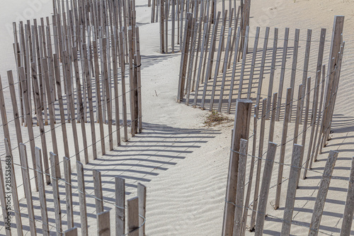 Wooden fence at a windy and sandy beach, Long Beach, New York