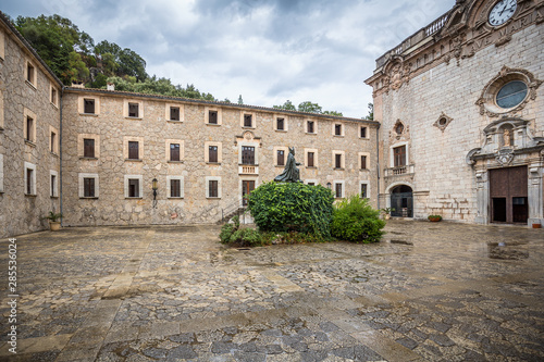 Memorial to bishop Pere-Joan Campins in cloistered courtyard of Santuario de lluc Monastery photo