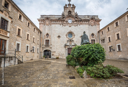 Memorial to bishop Pere-Joan Campins in cloistered courtyard of Santuario de lluc Monastery photo