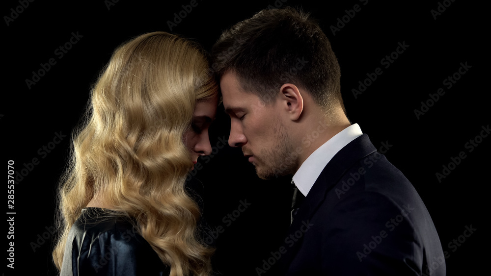 Man and woman touching foreheads, trust-based relations in young family, couple Man and woman touching foreheads, trust-based relations in young family, couple