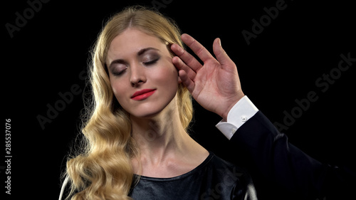 Male stroking womans face, choosing prostitute in bawdy house, one-night stand