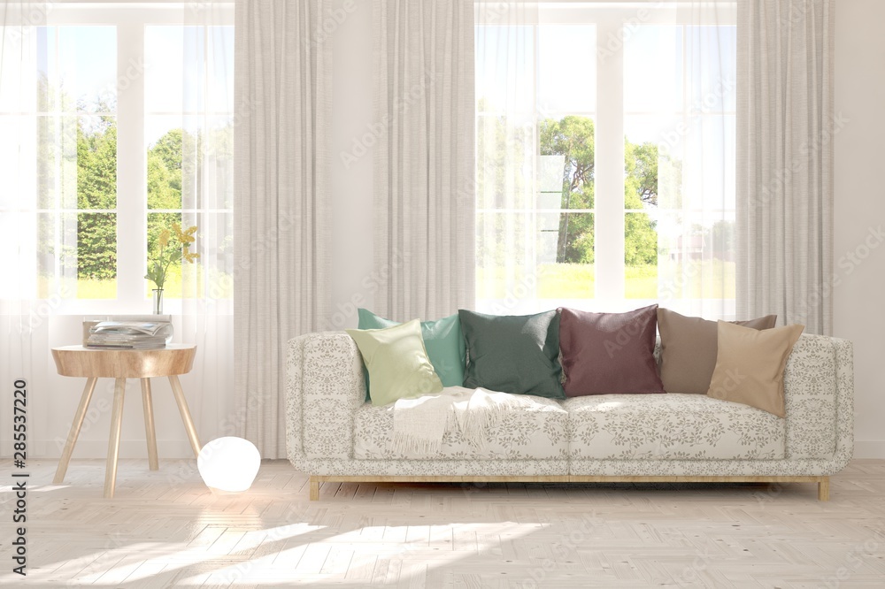 Fototapeta premium Stylish room in white color with sofa and summer landscape in window. Scandinavian interior design. 3D illustration