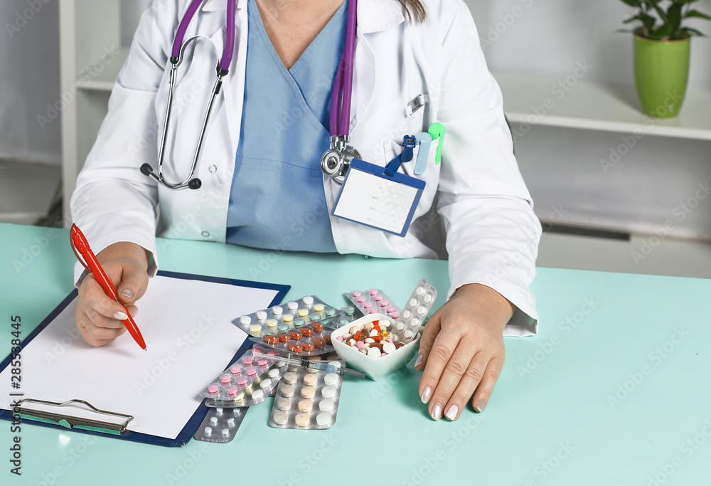 Woman doctor holds various pills in hand. Panacea, rescue service, prescribe drugs, legal pharmacy, treatment of diseases, blood pressure concept Woman doctor holds various pills in hand. Panacea, rescue service, prescribe drugs, legal pharmacy, treatment of diseases, blood pressure concept