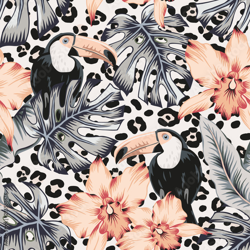 Toucans, orchid flowers, monstera, banana palm leaves, animal print background. Vector floral seamless pattern. Tropical illustration. Exotic plants, birds. Summer beach design. Paradise nature