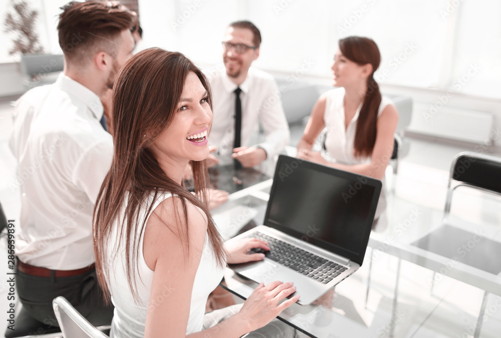 young business woman working on laptop in office. young business woman working on laptop in office.