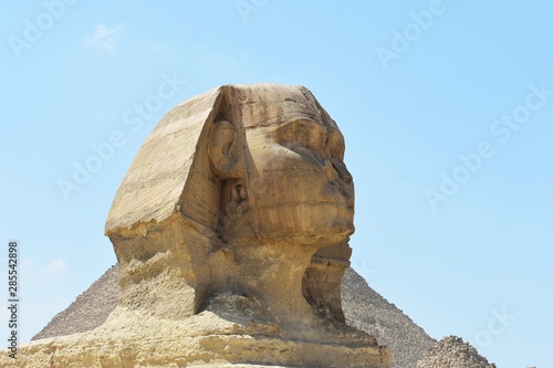 The head of the Great Sphinx of Giza, Cairo, Egypt. The Great Sphinx of Giza,  is a mythical creature with the head of a human and the body of a lion. photo