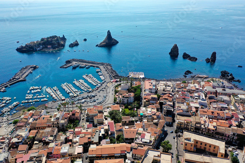 Acitrezza -Città e Faraglioni sul mare visti dal drone photo