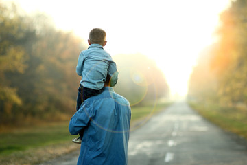 father and son walk in nature