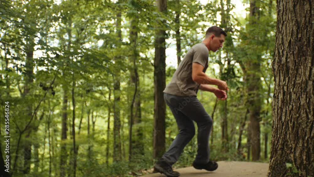 Man drives disc golf disc, long shot, slow motion Man drives disc golf disc, long shot, slow motion