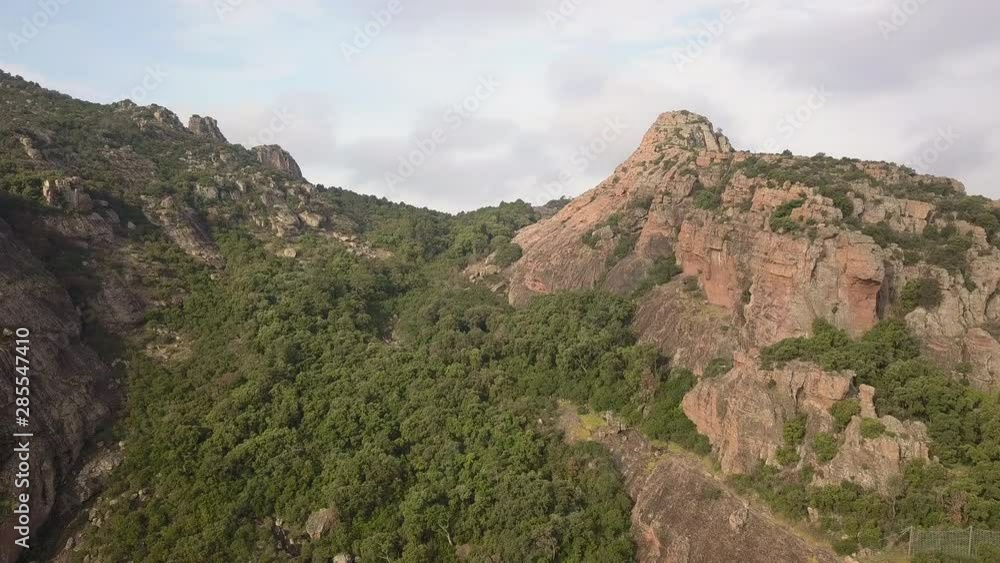 Drone panning around to reveal a beautiful vally and town in the distance in Frejus France Drone panning around to reveal a beautiful vally and town in the distance in Frejus France