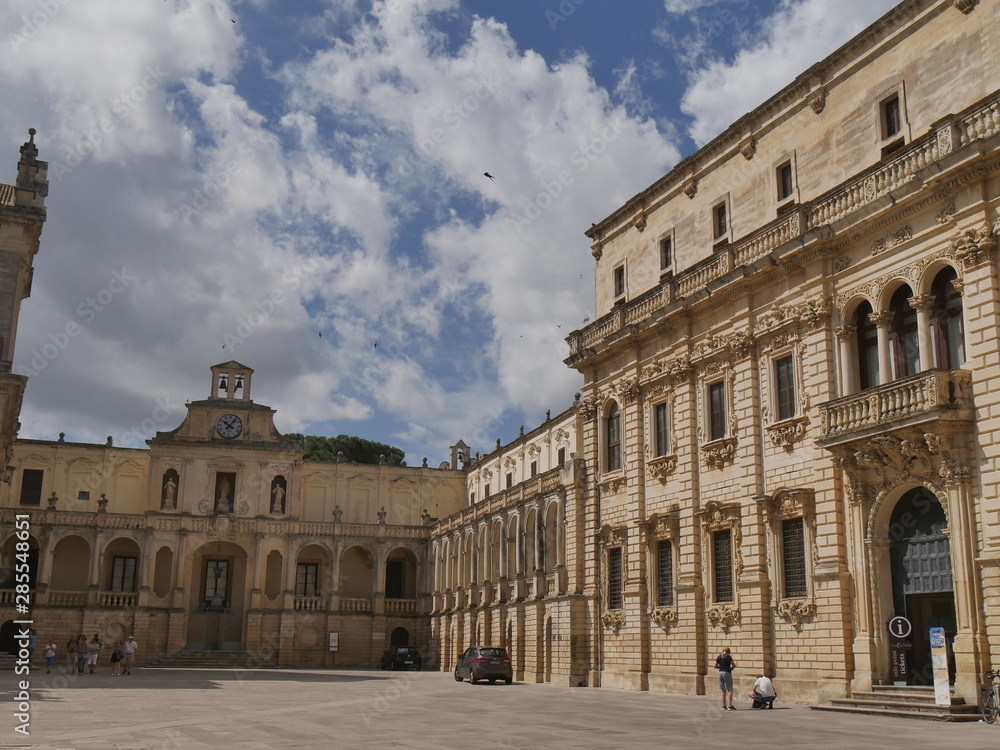 Lecce –  Bishop's palace. This monumental palace has a baroque facade surmounted by a clock and it is situated in Piazza Duomo of Lecce.