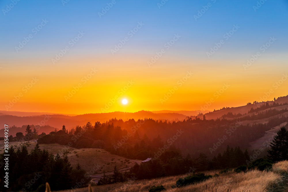 Sunset over Silhouetted hills, trees, forest, Mountains