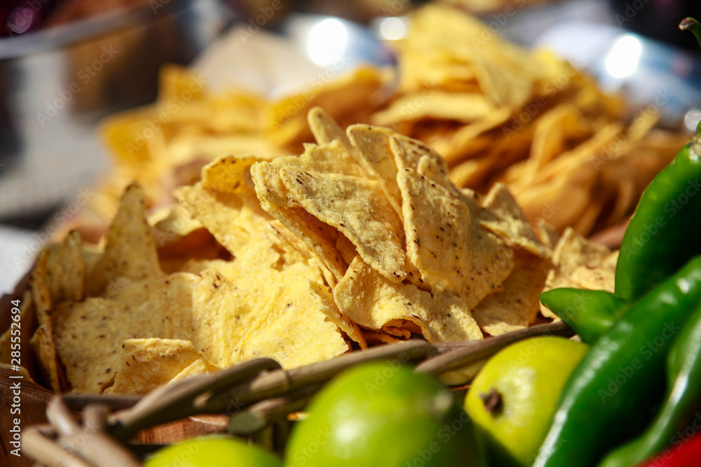 a plate of corn chips nachos in a street cafe a plate of corn chips nachos in a street cafe