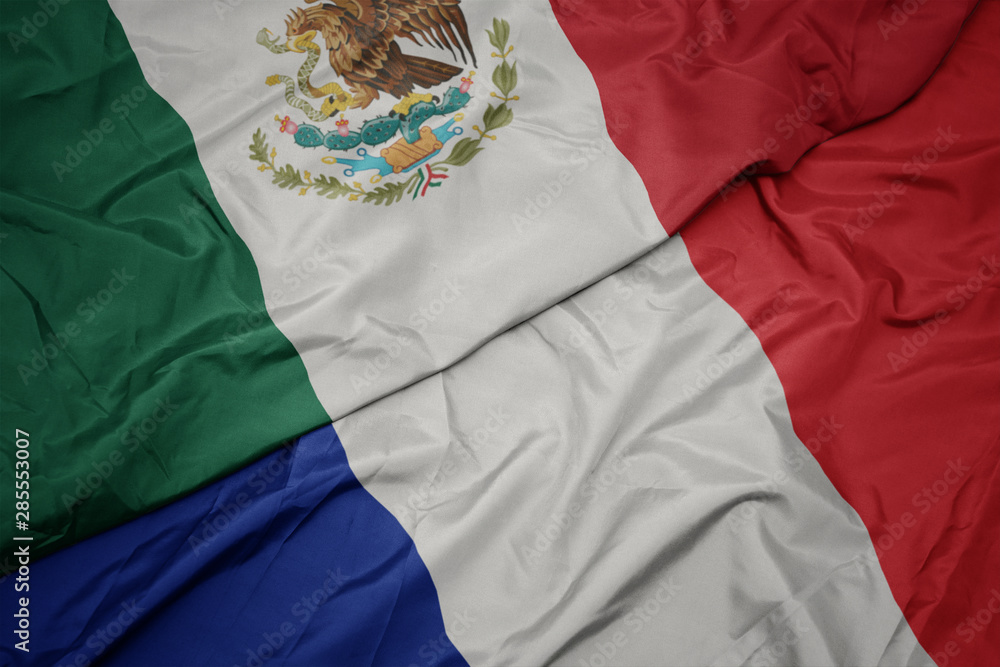 waving colorful flag of france and national flag of mexico. waving colorful flag of france and national flag of mexico.