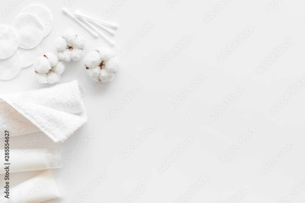 Hygiene cotton swabs, pads and cream for pattern on white background top view mock up Hygiene cotton swabs, pads and cream for pattern on white background top view mock up