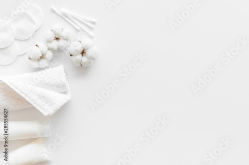 Hygiene cotton swabs, pads and cream for pattern on white background top view mock up