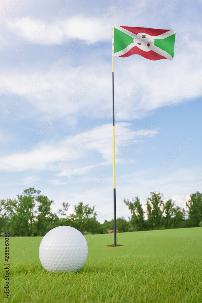 Obraz premium Burundi flag on golf course putting green with a ball near the hole