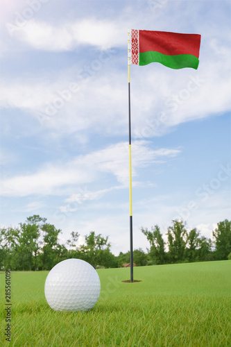 Belarus flag on golf course putting green with a ball near the hole