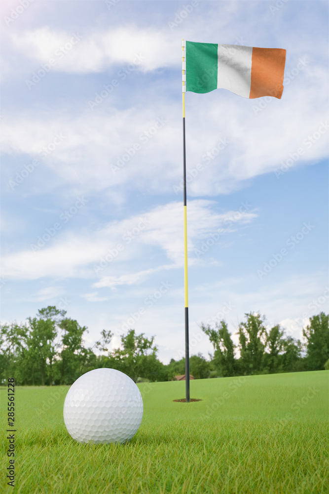 Obraz premium Ireland flag on golf course putting green with a ball near the hole