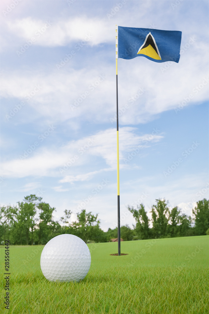 Obraz premium Saint Lucia flag on golf course putting green with a ball near the hole