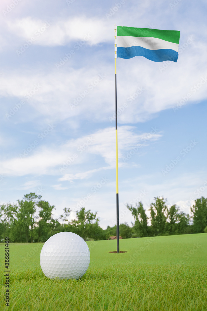 Obraz premium Sierra Leone flag on golf course putting green with a ball near the hole