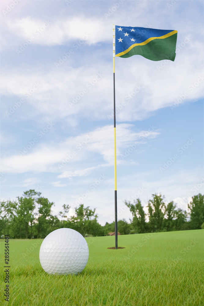 Obraz premium Solomon Islands flag on golf course putting green with a ball near the hole