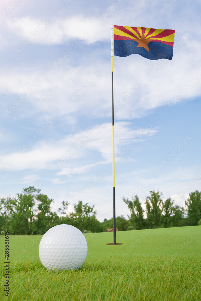 Obraz premium Arizona flag on golf course putting green with a ball near the hole