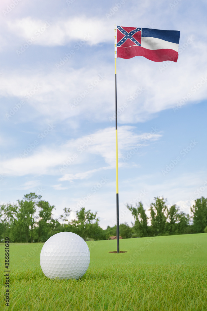 Obraz premium Mississippi flag on golf course putting green with a ball near the hole