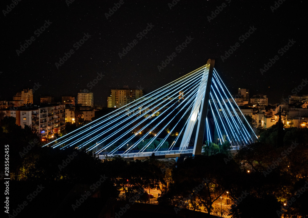 Obraz premium Marbella Bridge illuminated at night with blue LEDs
