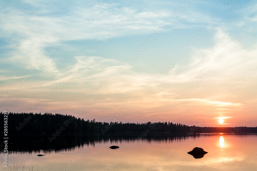 Beautiful sunset over lake in the Leivonmaki National Park, Finland