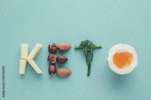 Keto word made from Ketogenic diet, low carb, healthy food on blue pastel background, new year health resolution