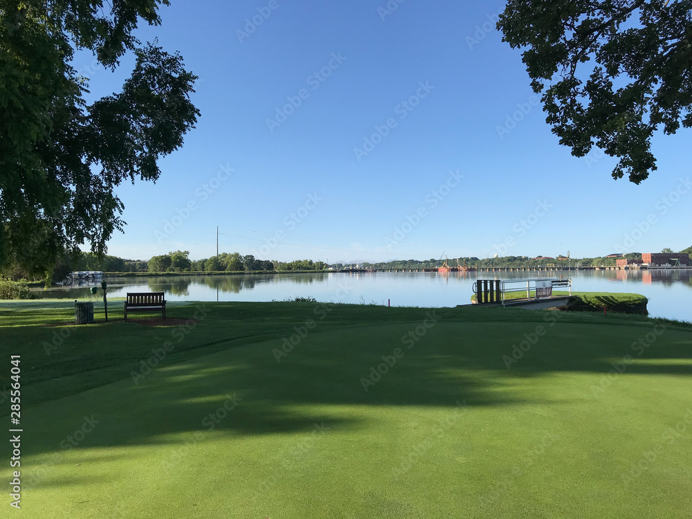 golf course on a sunny day by dam golf course on a sunny day by dam