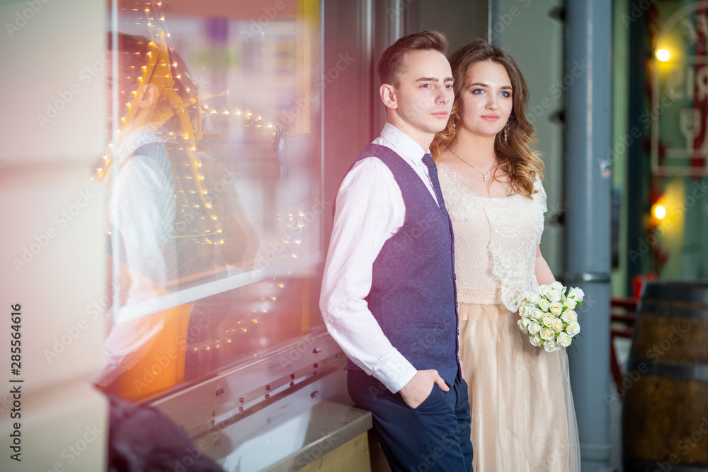 Naklejka premium Portrait of Happy Married couple Together Against Shop Window Outdoors.