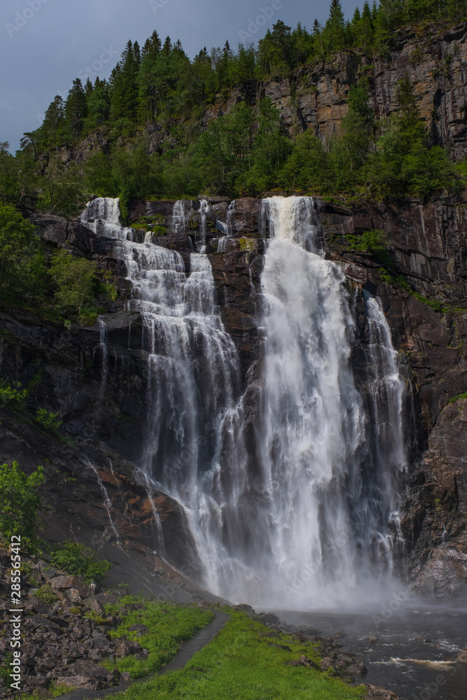Frontal view of the Skjervsfossen in summer, seen from the base. Norway. July 2019
