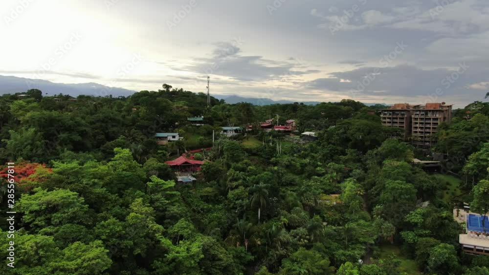 Aerial view of houses and apartments nestled in rain forest in Manuel Antonio Costa Rica Aerial view of houses and apartments nestled in rain forest in Manuel Antonio Costa Rica