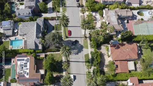 Flying above Beverly Hills street with palms in California